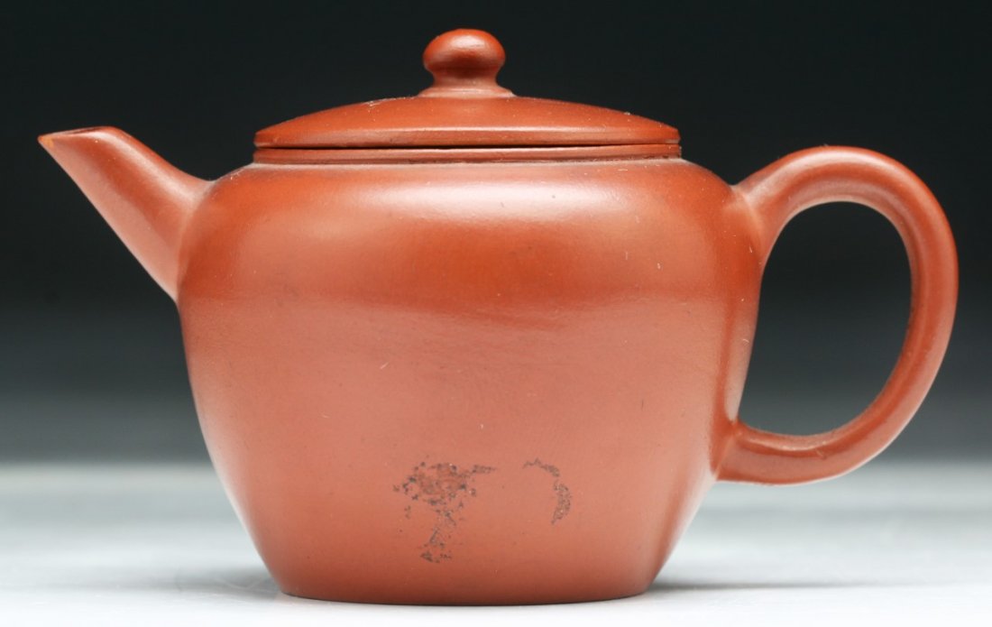 A Chinese Yixing Zisha Teapot: A Chinese Yixing Zisha Teapot; Size: L: 3-1/4"