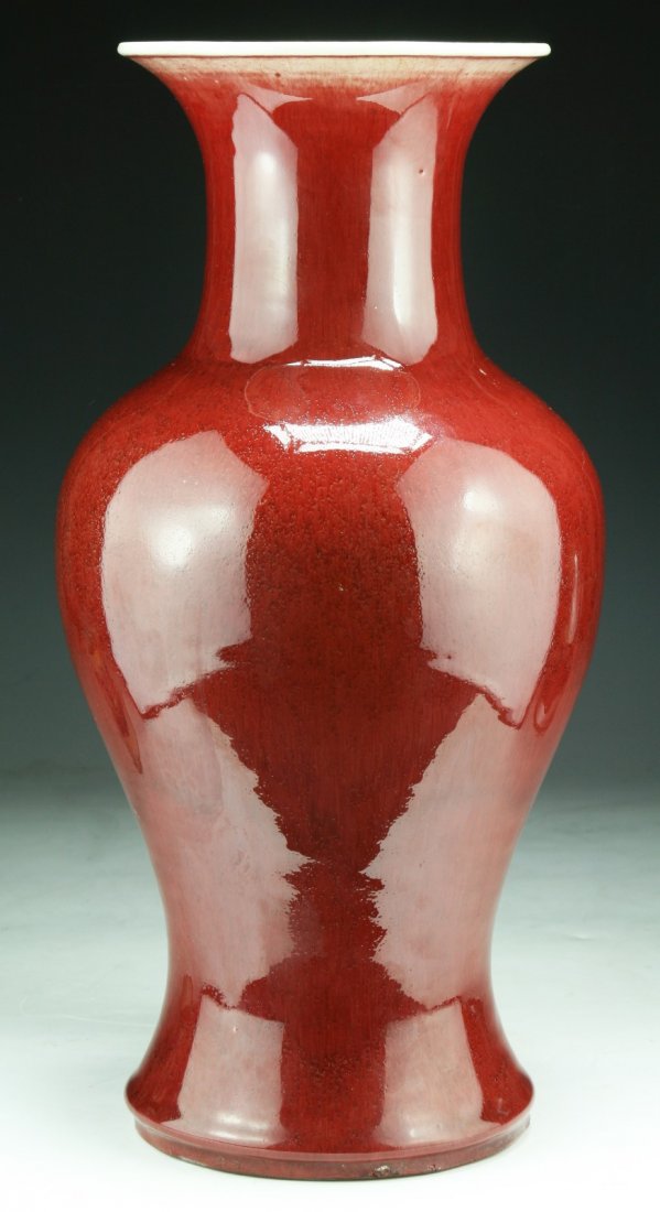 A Chinese Antique Ox Blood Red Glazed Porcelain Vase: A Chinese Antique Ox Blood Red Glazed Porcelain Vase: of Middle Qing Dynasty; Size: H: 16"