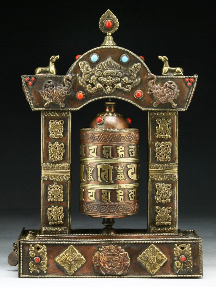 A Tibetan Antique Jeweled Bronze Prayer Wheel: A Tibetan Antique Jeweled Bronze Prayer Wheel: inlaid with natural red coral and turquoise cabochons; Size: H: 12"