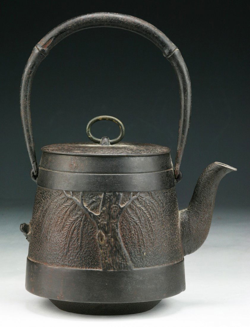 A Japanese Antique Iron Teapot With Cover: A Japanese Antique Iron Teapot With Cover: Circa 1900; Size: H: 9-3/4"; L: 7-1/4"
