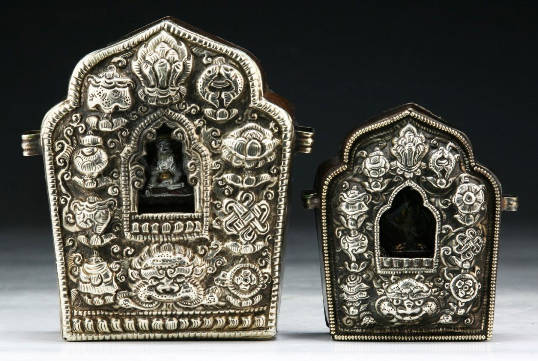 Two (2) Tibetan Antique Repousse Silvered Shrine: Two (2) Tibetan Antique Repousse Silvered Shrine: the front with Buddhist emblems in relief, deity to interior, the verso in typical copper, of 19th Century; Size: H: 5" (biggest)