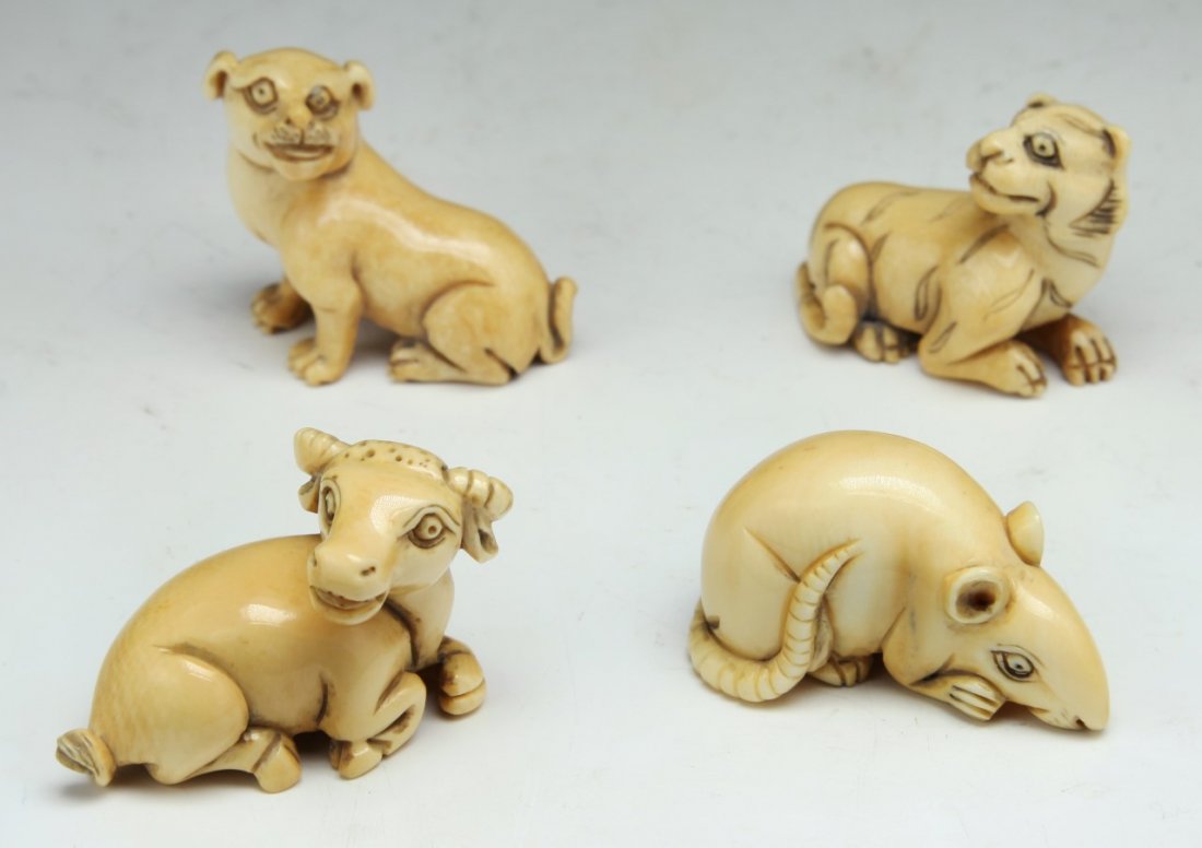 Four (4) Japanese Antique Carved Ivory Netsuke: Four (4) Japanese Antique Carved Ivory Netsuke: including two dogs, rabbit and rodent; Size: L: 1-3/4" (biggest)