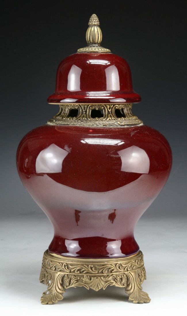 A Chinese Antique Ox Blood Porcelain Vase: A Chinese Antique Ox Blood Porcelain Vase: of globular shouldered form with ormolu mountings and a matching lid, of Qing Dynasty KANGXI Period; Size: H: 14-3/4"