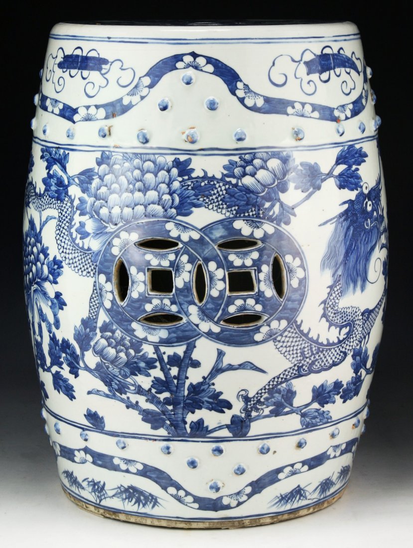 A Big Chinese Antique Blue & White Porcelain Garden: A Big Chinese Antique Blue & White Porcelain Garden Stool: with the design of dragons amid blooming trees, of Middle Qing Dynasty; Size: H: 19"