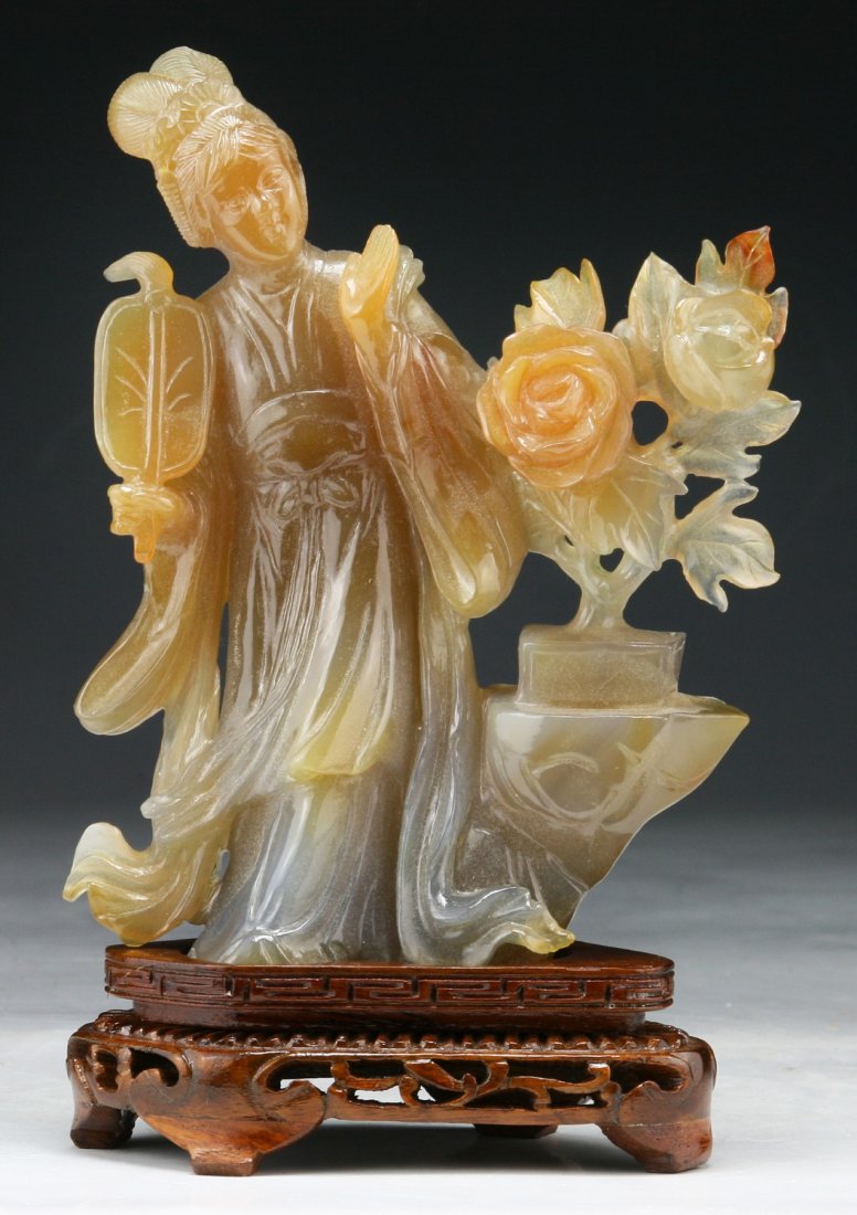 A Chinese Antique Carnelian Agate Carved Beauty Group: A Chinese Antique Carnelian Agate Carved Beauty Group: presented on a wood stand; Size: H: 6"; (overall) H: 7-1/2"