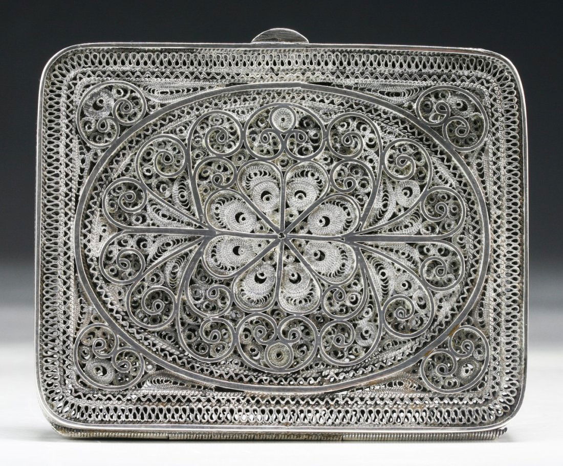 A Japanese Antique Filigree Silver Cigarette Case: A Japanese Antique Filigree Silver Cigarette Case: with extremely detailed filigree artwork, Circa 1900; Size: L: 3-1/8"