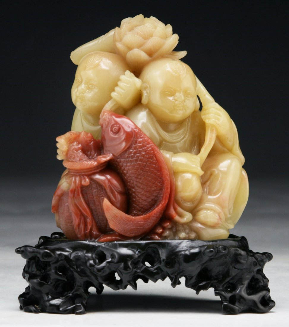 A Fine Chinese SHOUSHAN Soapstone Carving: A Fine Chinese SHOUSHAN Soapstone Carving: finely carved as two children with fish beside their feet; presented on a wood stand; Size: H: 3-1/2"; (overall) H: 4-1/2"