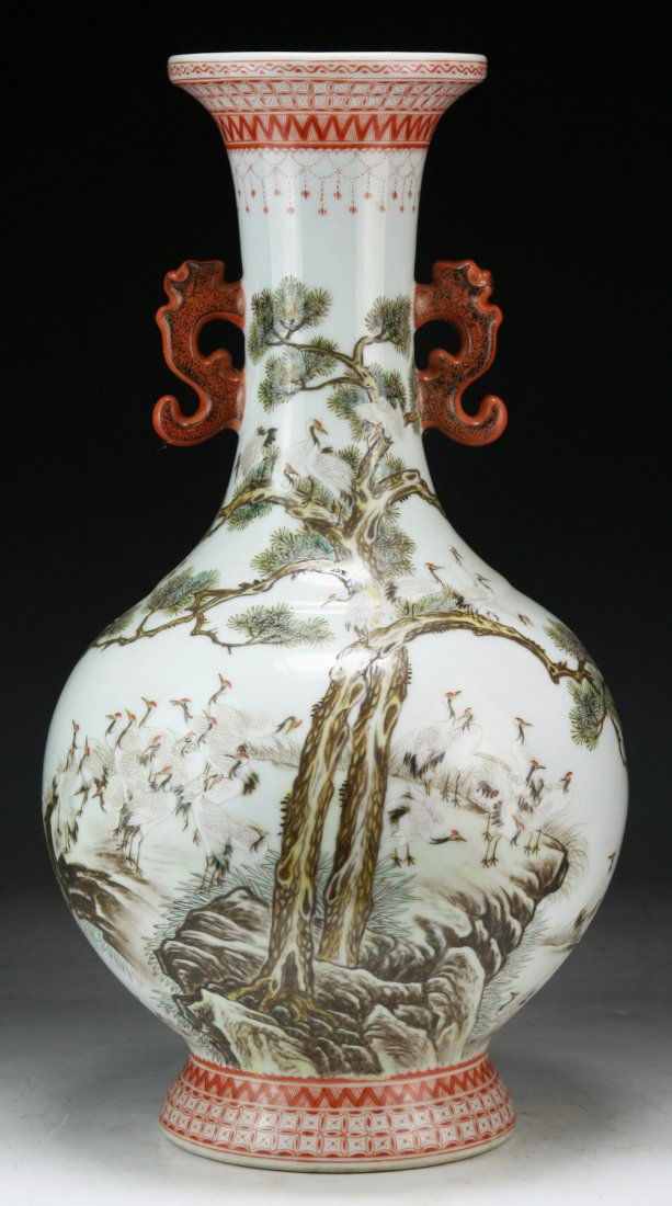 A Chinese Antique Famille Rose Porcelain Vase: A Chinese Antique Famille Rose Porcelain Vase: of globular form rising a cylindrical neck with two Chi dragon handles around the shoulder; Size: H: 17-1/4"