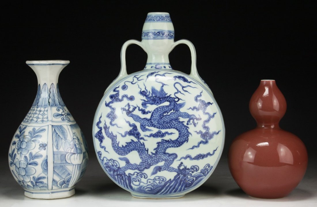 Three (3) Chinese Porcelain Vases: Three (3) Chinese Porcelain Vases: includes two blue & white vases, and one ox blood glazed gourd shaped vase with 'KANGXI' sign on the base; Size: H: 12-1/4" (biggest)