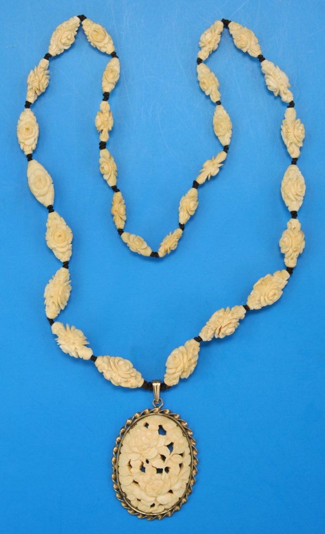 A Chinese Antique Ivory Carved Pendant & Bead Necklace: A Chinese Antique Ivory Carved Pendant & Bead Necklace: comprised of ovoid flower carved beads with a flower pendent pending, African ivory, Minguo Period (Early 20th Century), NO INTERNATIONAL SHIPPI
