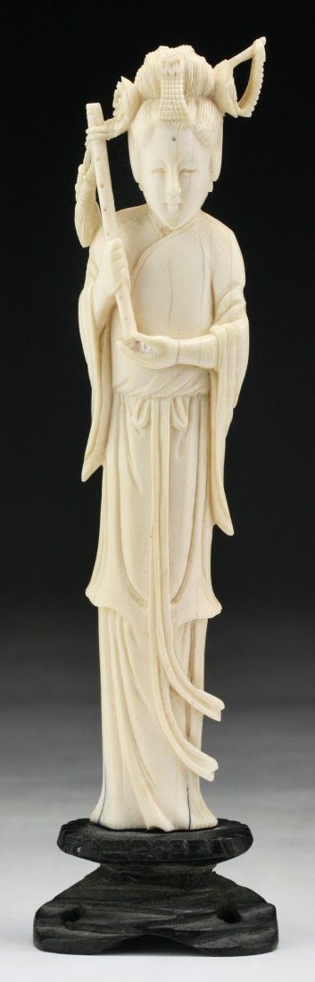 A Chinese Antique Ivory Carved Beauty: A Chinese Antique Ivory Carved Beauty: standing in a long flowing robe; presented on a wood stand, African ivory, Late Qing Dynasty (19th Century), NO INTERNATIONAL SHIPPING OF IVORY ITEMS; Size: H: 6
