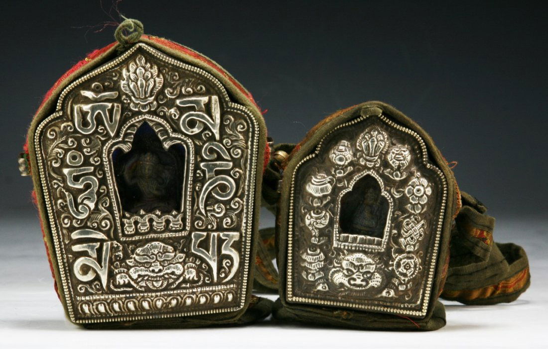 Two (2) Tibetan Antique Repousse Silvered Shrines: Two (2) Tibetan Antique Repousse Silvered Shrines: the front with Buddhist emblems in relief, deity to interior, the verso in typical copper, of 19th Century; Size: H: 5" (biggest)