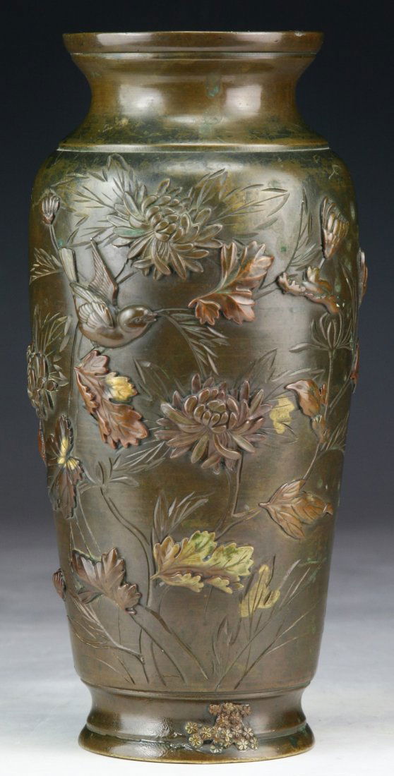 A Japanese Antique Bronze Vase: A Japanese Antique Bronze Vase: of shouldered body with short neck, incised with the scene of birds amid leafy branches, of 19th Century; Size: H: 8-1/4"
