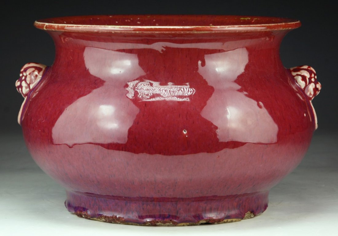 A Chinese Antique Ox Blood Glazed Porcelain Jar: A Chinese Antique Ox Blood Glazed Porcelain Jar: of Late Qing Dynasty; Size: D: 8-3/4"; H: 6-1/5"