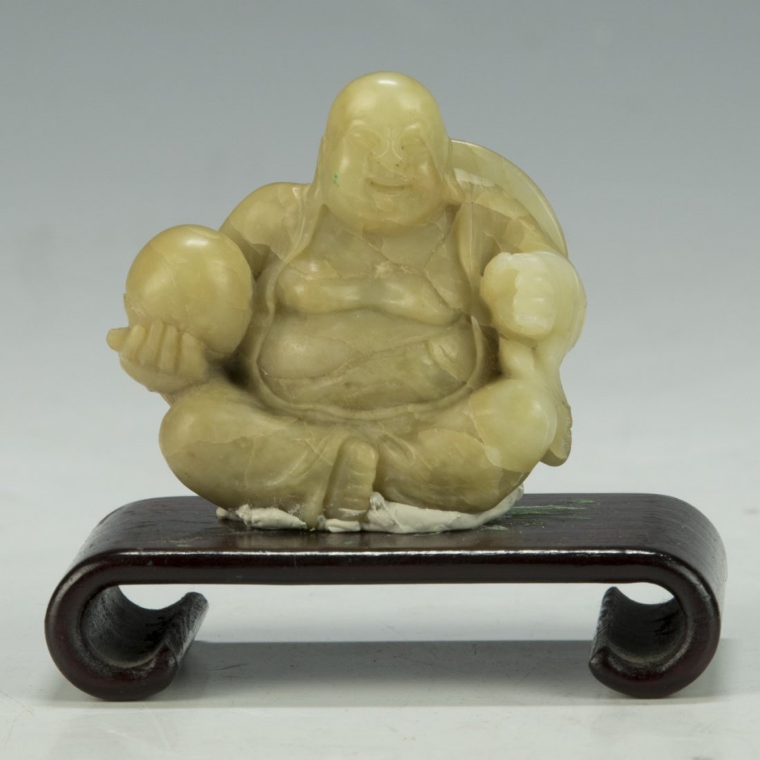 A Chinese Soapstone Carved Buddha: A Chinese Soapstone Carved Buddha; Size: H: 2"; (overall) H: 3"