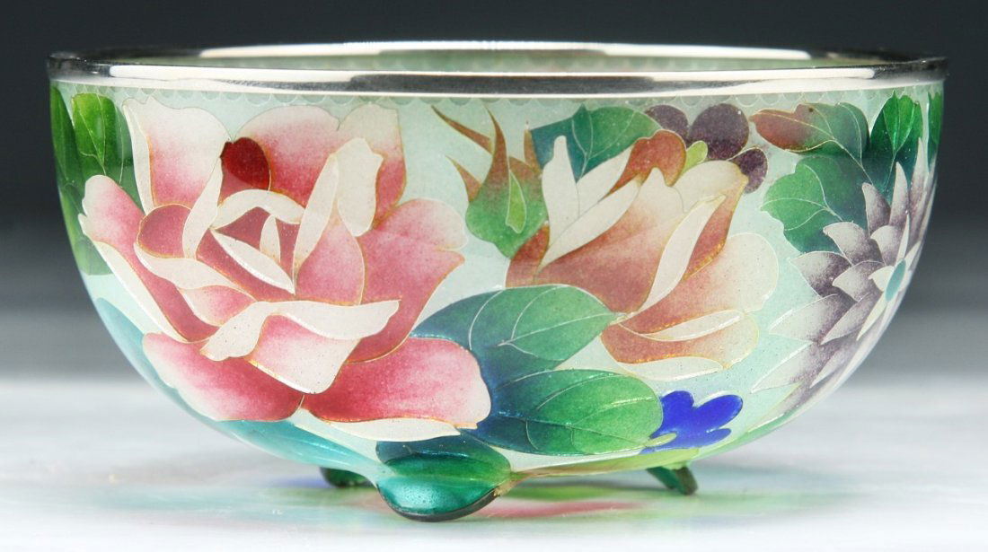 A Fine Japanese Antique Plique-A-Jour Bowl: A Fine Japanese Antique Plique-A-Jour Bowl: transparent cloisonne enamel bowl, the stained glass-like effect with the design of vari-colored blossoms and foliage reserved on a light green ground, silv