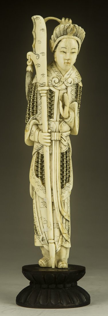 A Chinese Antique Ivory Carved Beauty: A Chinese Antique Ivory Carved Beauty: Finely carved beauty standing in warrior style robes holding a long sword; presented on a wood stand, African ivory, of 19th Century, NO INTERNATIONAL SHIPPING O