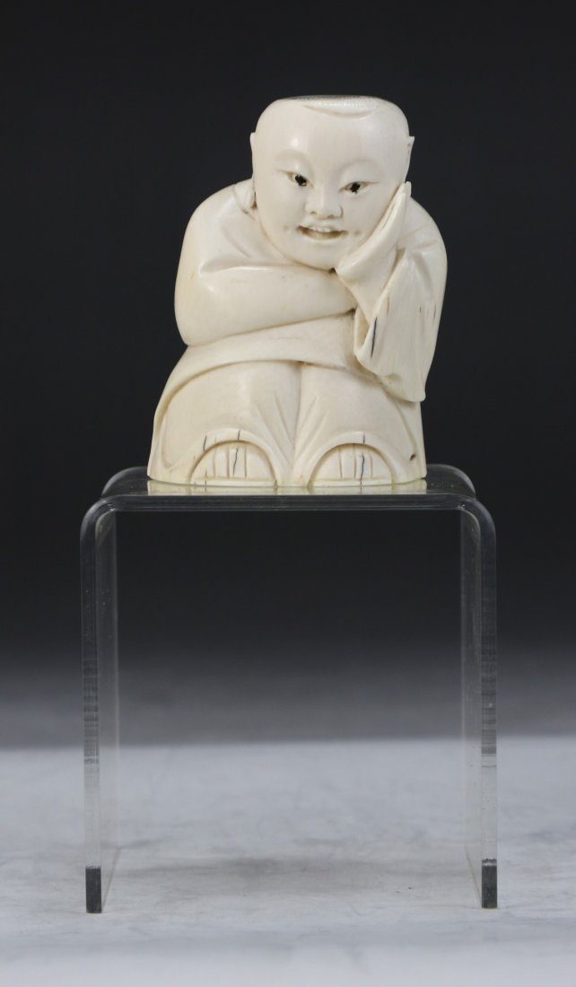 A Chinese Antique Ivory Carved Figure: A Chinese Antique Ivory Carved Figure: finely carved as a young child in robes, African ivory, of late Qing Dynasty (19th Century), NO INTERNATIONAL SHIPPING OF IVORY ITEMS; Size: H: 2-3/4"