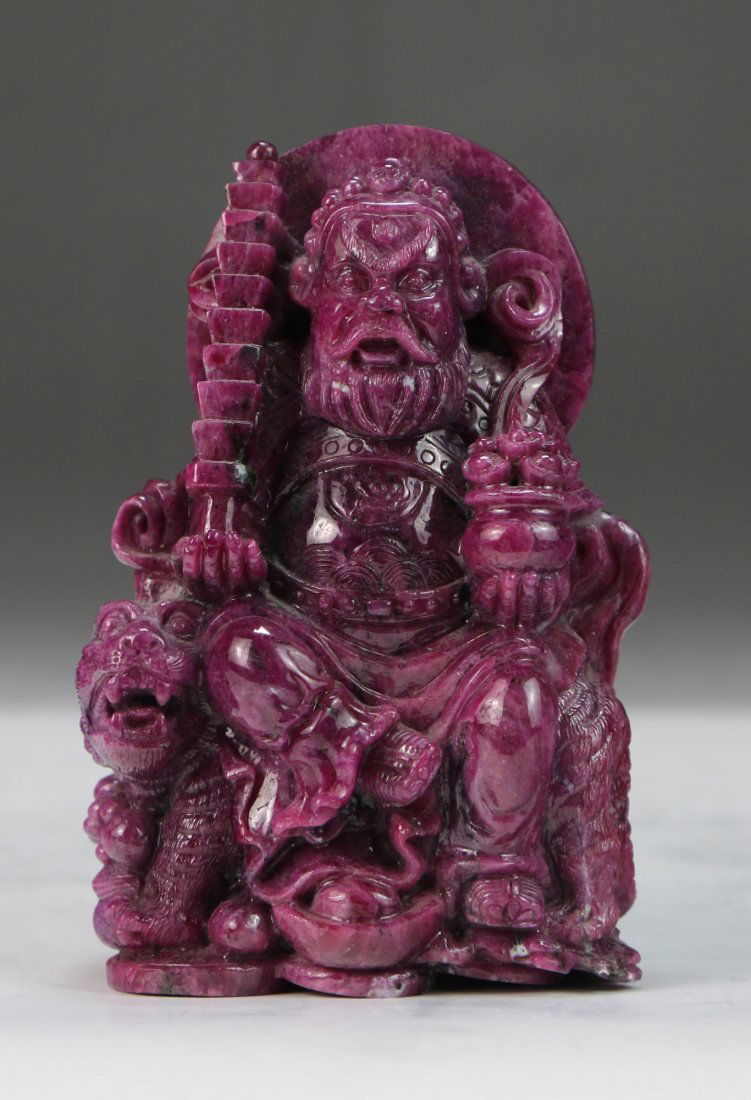 A Chinese Natural Ruby Matrix Carved Vaisrava?a (God of (1 of 4)