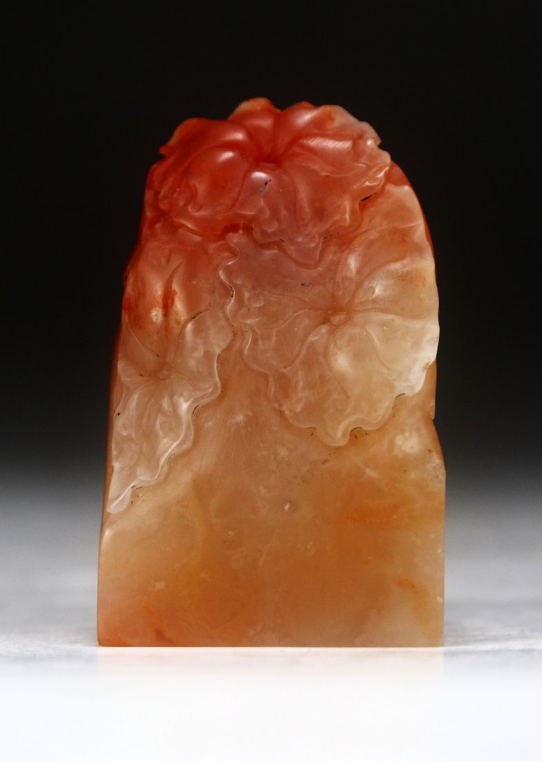 A Soapstone Carved Seal: A Soapstone Carved Seal: of rectangular form finely carved with flowers; Size: H: 2-1/2"
