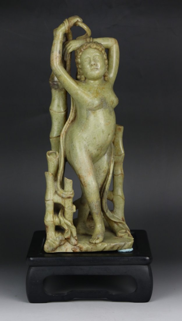 A Soapstone Carved Figure Of Naked Girl: A Soapstone Carved Figure Of Naked Girl: finely carved as a nude woman, presented on a wood stand; Size: H: 13-1/2"; (overall) H: 16"
