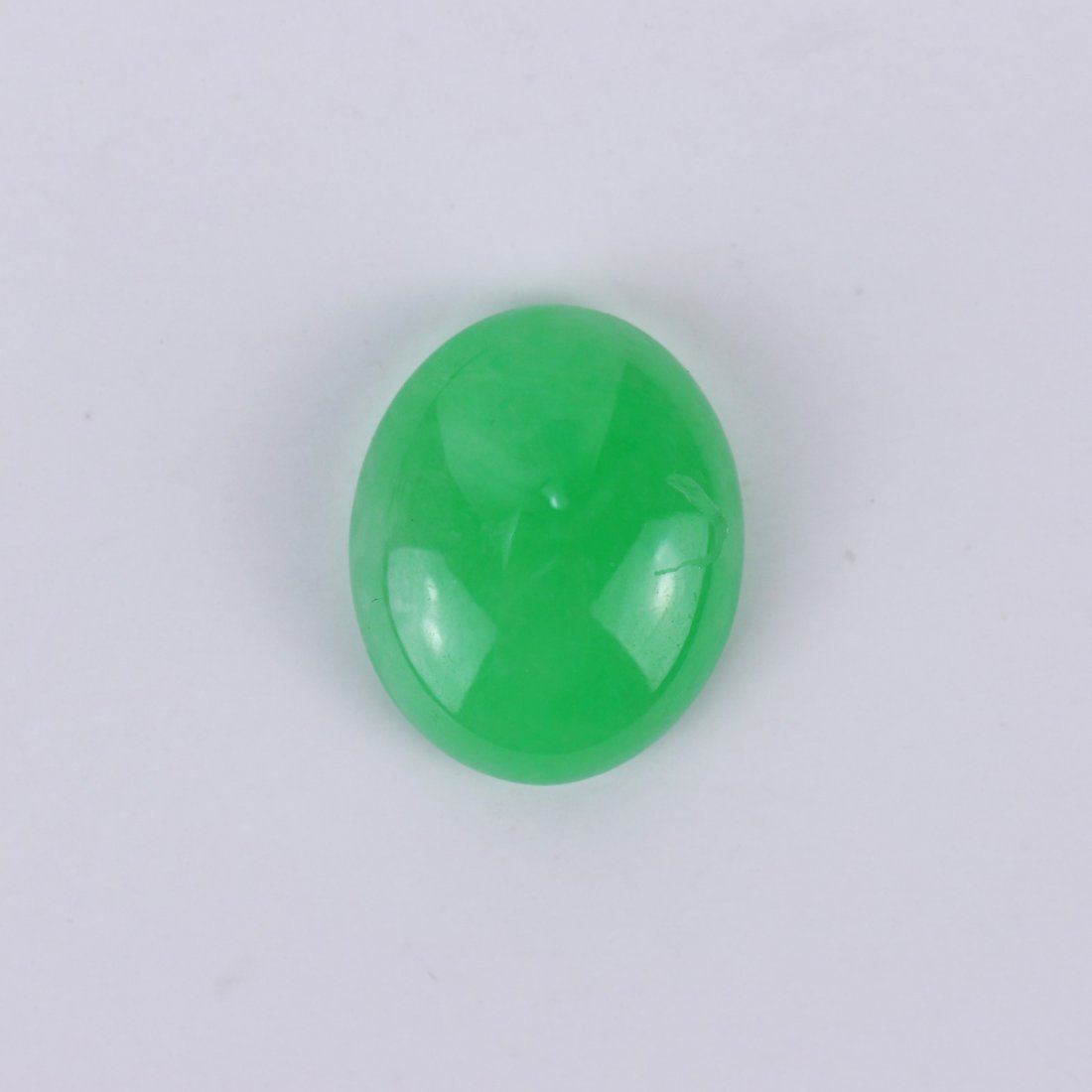 A Translucent Apple Green Jadeite Cabochon With AIGL (1 of 3)