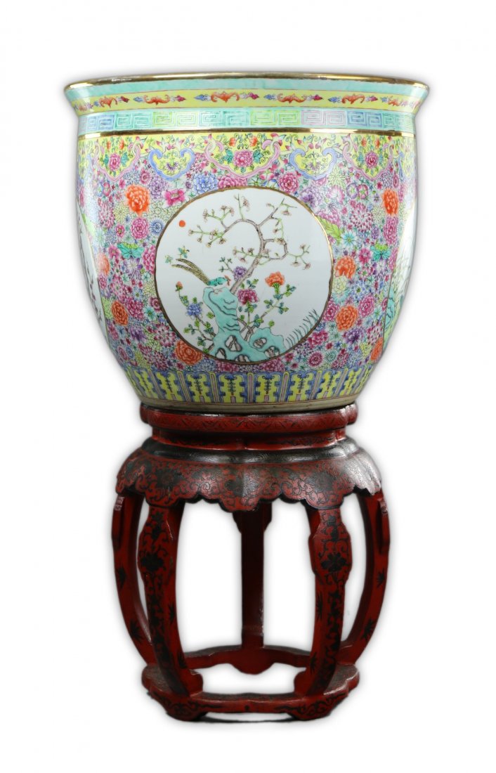 A Massive Chinese Antique Famille Rose Porcelain Jar: A Massive Chinese Antique Famille Rose Porcelain Jar: of globular form with panels of birds and blooming branches around the body on a vibrant floral pattern ground, the interior with orange fish and
