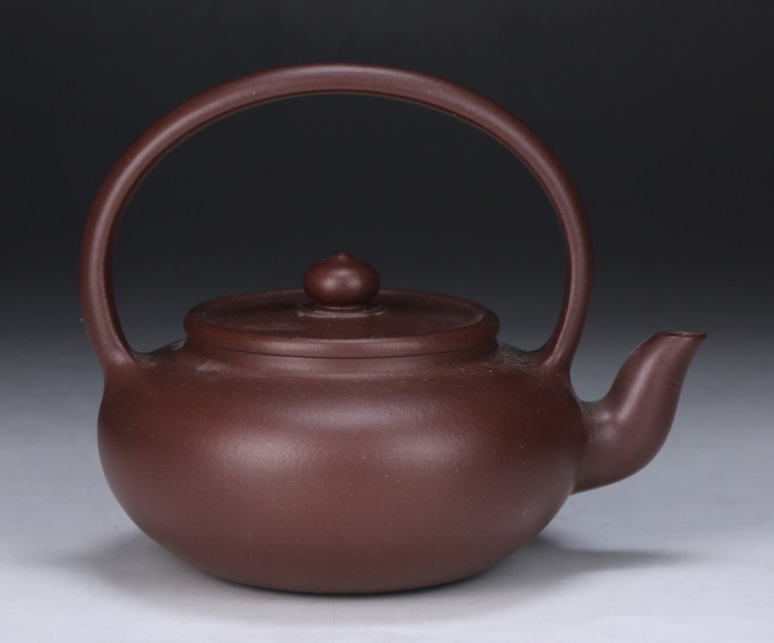A Chinese Yixing Zisha Teapot: A Chinese Yixing Zisha Teapot; Size: L: 5-1/2"