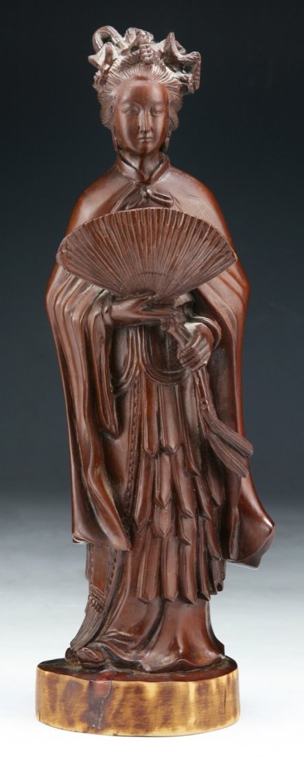 A Chinese Antique Wood Carved Beauty: A Chinese Antique Wood Carved Beauty: carved as a beauty standing in flowing robes; Size: H: 9-3/4"