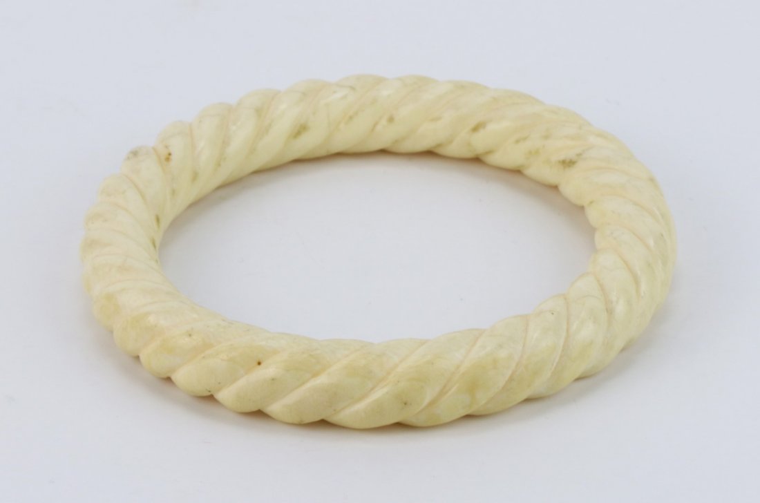 An Antique Ivory Carved Bangle: An Antique Ivory Carved Bangle: African ivory, of early 20th Century, NO INTERNATIONAL SHIPPING OF IVORY ITEMS; Size: D: 3-3/8"