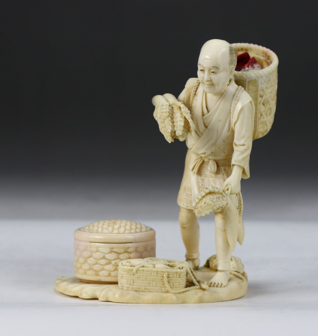 A Japanese Antique Ivory Carved Figure: A Japanese Antique Ivory Carved Figure: finely carved as a man carrying a basket on his back while holding vegetables, African ivory, of early 20th Century, NO INTERNATIONAL SHIPPING OF IVORY ITEMS; S
