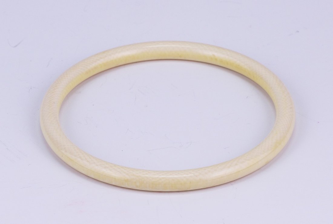An Antique Ivory Carved Bangle: An Antique Ivory Carved Bangle: African ivory, circa 1900, NO INTERNATIONAL SHIPPING OF IVORY ITEMS; Size: D: 3"