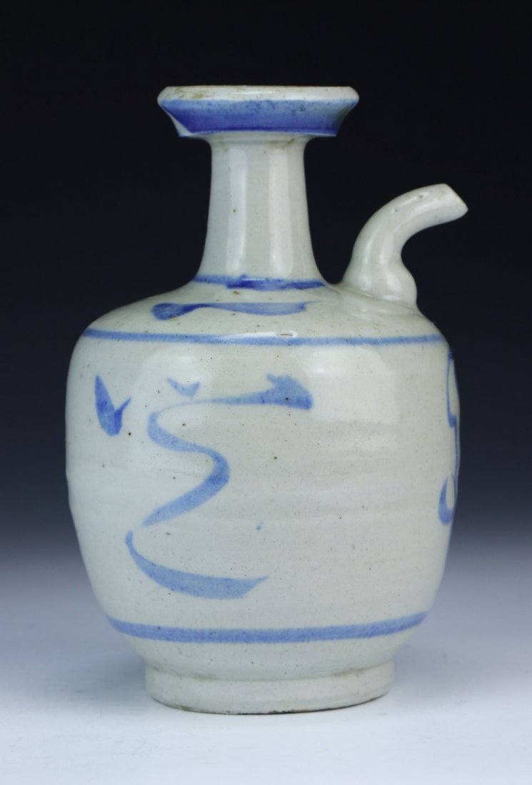 A Chinese Antique Blue & White Porcelain Wine Pot: A Chinese Antique Blue & White Porcelain Wine Pot: with a globular body attached with an upward rising spout, of 17th Century; Size: H: 6-1/2"