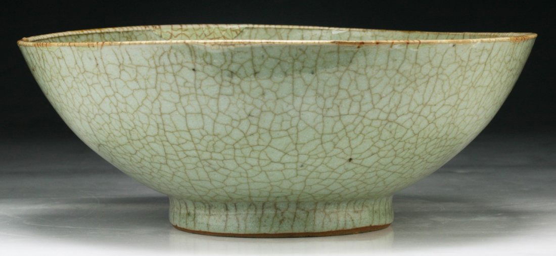 A Chinese Antique Celadon Porcelain Bowl: A Chinese Antique Celadon Porcelain Bowl: of QING Dynasty; Size: D: 9-1/2"