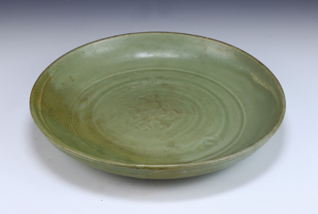 A Chinese Antique Longquan Glaze Porcelain Plate: A Chinese Antique Longquan Glaze Porcelain Plate: applied overall with opaque celadon glaze; Size: D: 10-3/4"