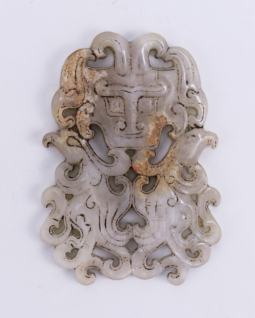 A Finely Carved White Jade Archaistic Plaque (1 of 2)