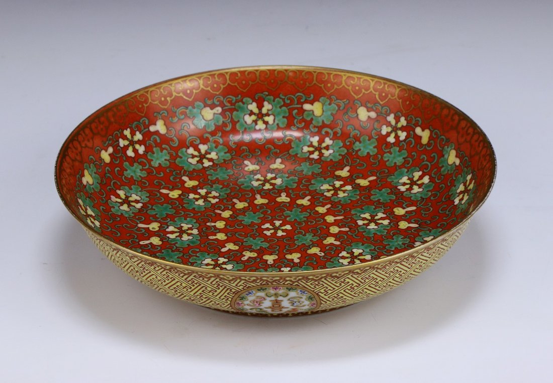 A Chinese Antique Famille Rose Porcelain Plate: A Chinese Antique Famille Rose Porcelain Plate: of shallow shape, finely painted to the interior with continuous design of lotus blossoms amid leaves while the exterior with four fortunate character m