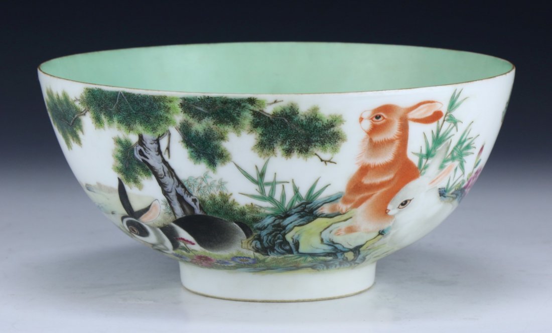 A Big Chinese Antique Famille Rose Porcelain Bowl: A Big Chinese Antique Famille Rose Porcelain Bowl: the exterior finely painted with rabbits amid blossoming branches, the interior with a turquoise glazed enamel, signed with QIANLONG reign mark on th