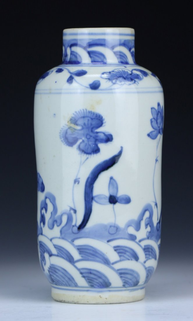 A Chinese Antique Blue & White Porcelain Vase: A Chinese Antique Blue & White Porcelain Vase: of ovoid form, the exterior finely painted with blossoms amid scrolling waves; Size: H: 6-1/2"