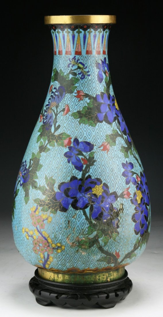 A Chinese Antique Cloisonne on Bronze Vase: A Chinese Antique Cloisonne on Bronze Vase: of QING Dynasty, presented on a wood stand; Size: H: 15"; (overall) H: 16-1/2"