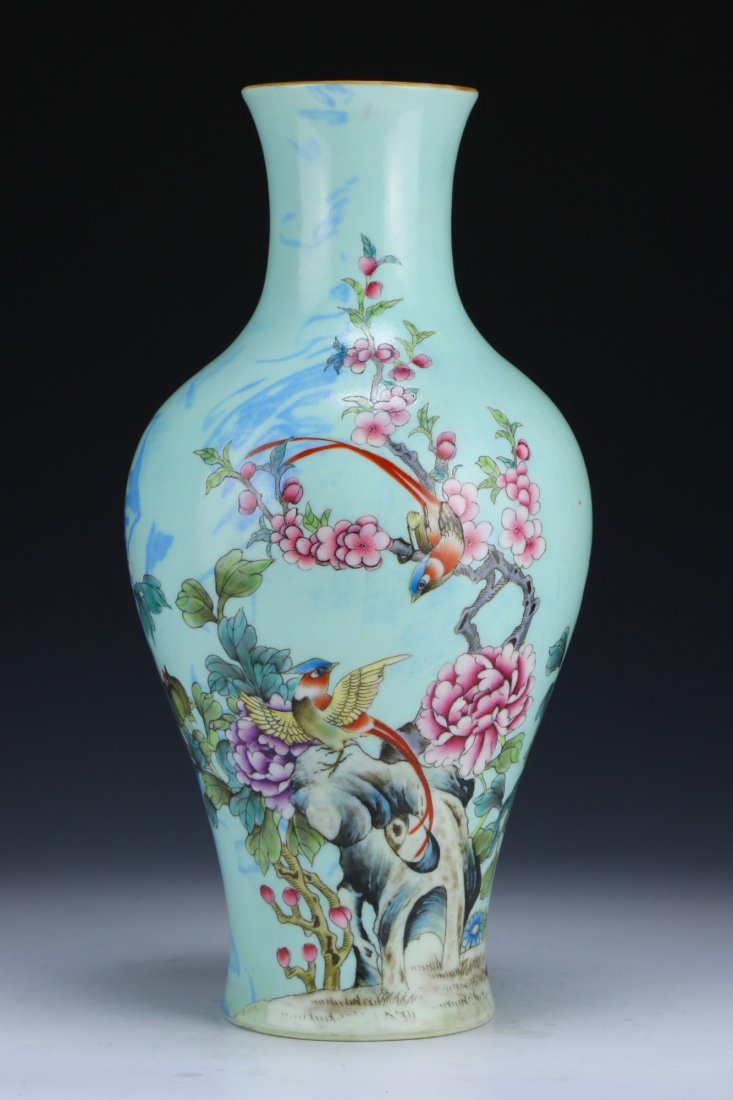 A Chinese Antique Famille Rose Porcelain Vase: A Chinese Antique Famille Rose Porcelain Vase: of elegant shouldered form waisted to the base, finely painted with blossoming branches and birds on a turquoise glazed ground, with a underglaze blue an