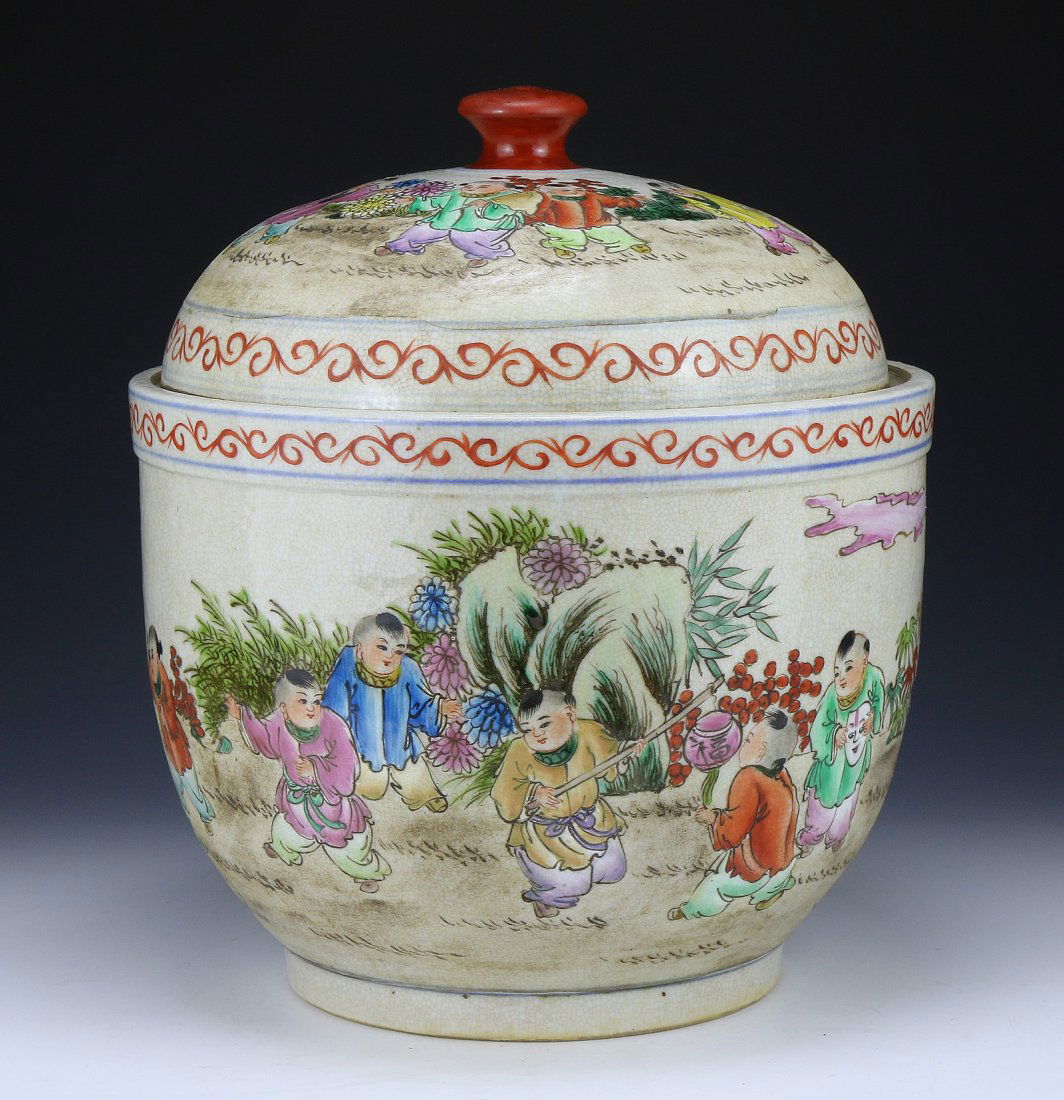 A Chinese Antique Famille Rose Porcelain Lidded Jar: A Chinese Antique Famille Rose Porcelain Lidded Jar: of globular form with a domed shaped cover, finely painted with children playing in a blooming field, the base with a six character KANGXI mark in
