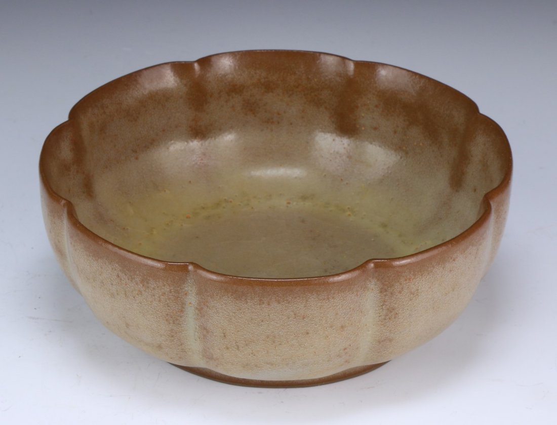 A Chinese Antique Celadon Glazed Bowl: of circular form, with the milky white interior extending upwards into a light reddish finish around the rim; Size: D: 6-1/4" (16cm)