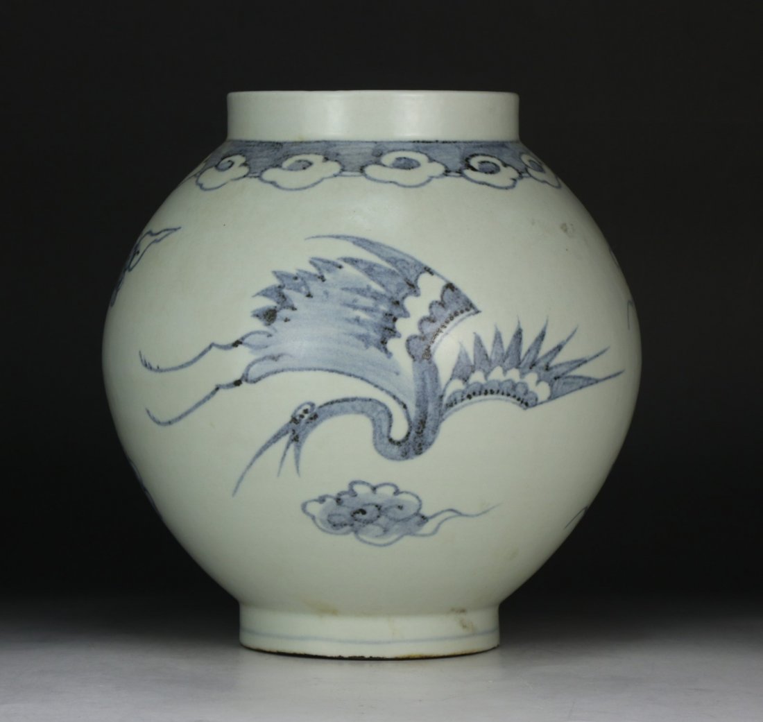 A Chinese Antique Blue & White Porcelain Vase: of globular form, with a large cylindrical and straight opening at the top, finely painted with birds in flight; Size: H: 10" (25cm)