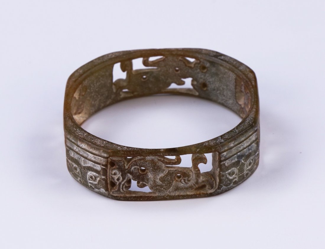 An Archaic Jade Carved Bangle (1 of 2)