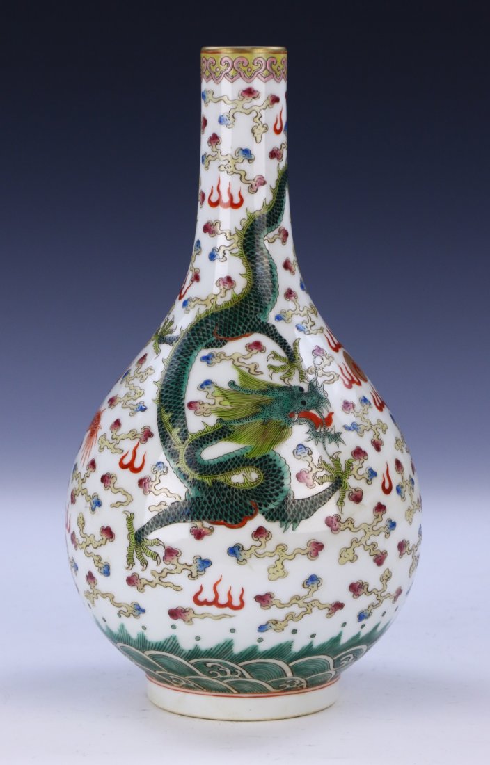 A Chinese Antique Famille Rose Porcelain Vase: A Chinese Antique Famille Rose Porcelain Vase: Of Bulbous Form, With A Slim And Cylindrical Neck Extending Upwards To A Flat Rim, Finely Painted With Sprawling Dragons Along The Body, Signed Yongzheng