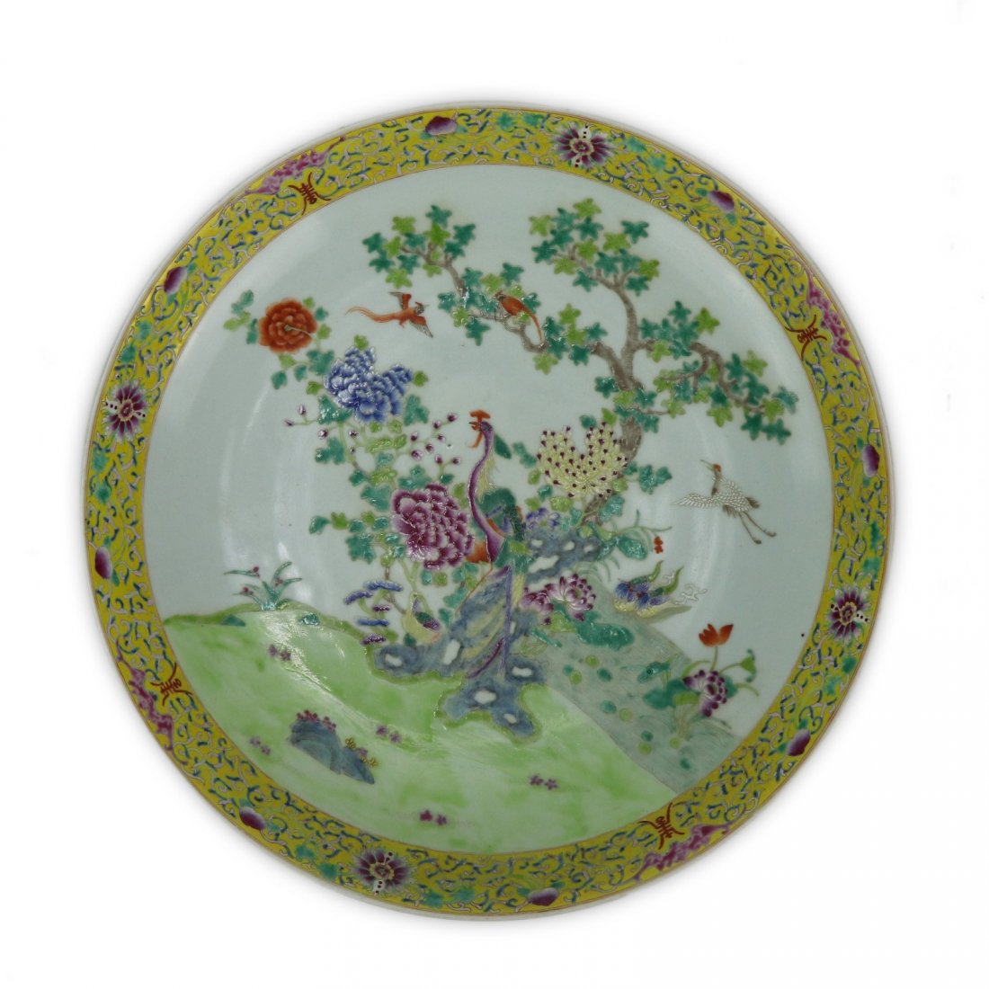 A Chinese Antique Famille Rose Porcelain Charger: A Chinese Antique Famille Rose Porcelain Charger: Of Circular Form With The Scene Of A Phoenix And Crane Amid Blooming Branches On A Grassy Field, With A Double Circle Sign in Cobalt Blue On The Base;