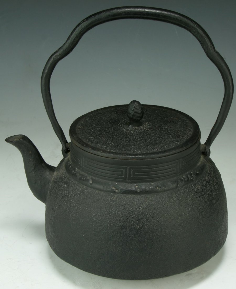 A Japanese Antique Iron Teapot: A Japanese Antique Iron Teapot With Cover: Of 19Th Century; Size: H: 10"; L: 8-1/4"