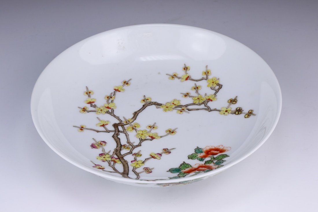 A Chinese Antique Famille Rose Porcelain Plate: A Chinese Antique Famille Rose Porcelain Plate: The interior Finely Painted With A Flowering Branches, With A 'Yongzheng' Mark On The Base; Size: D: 8"