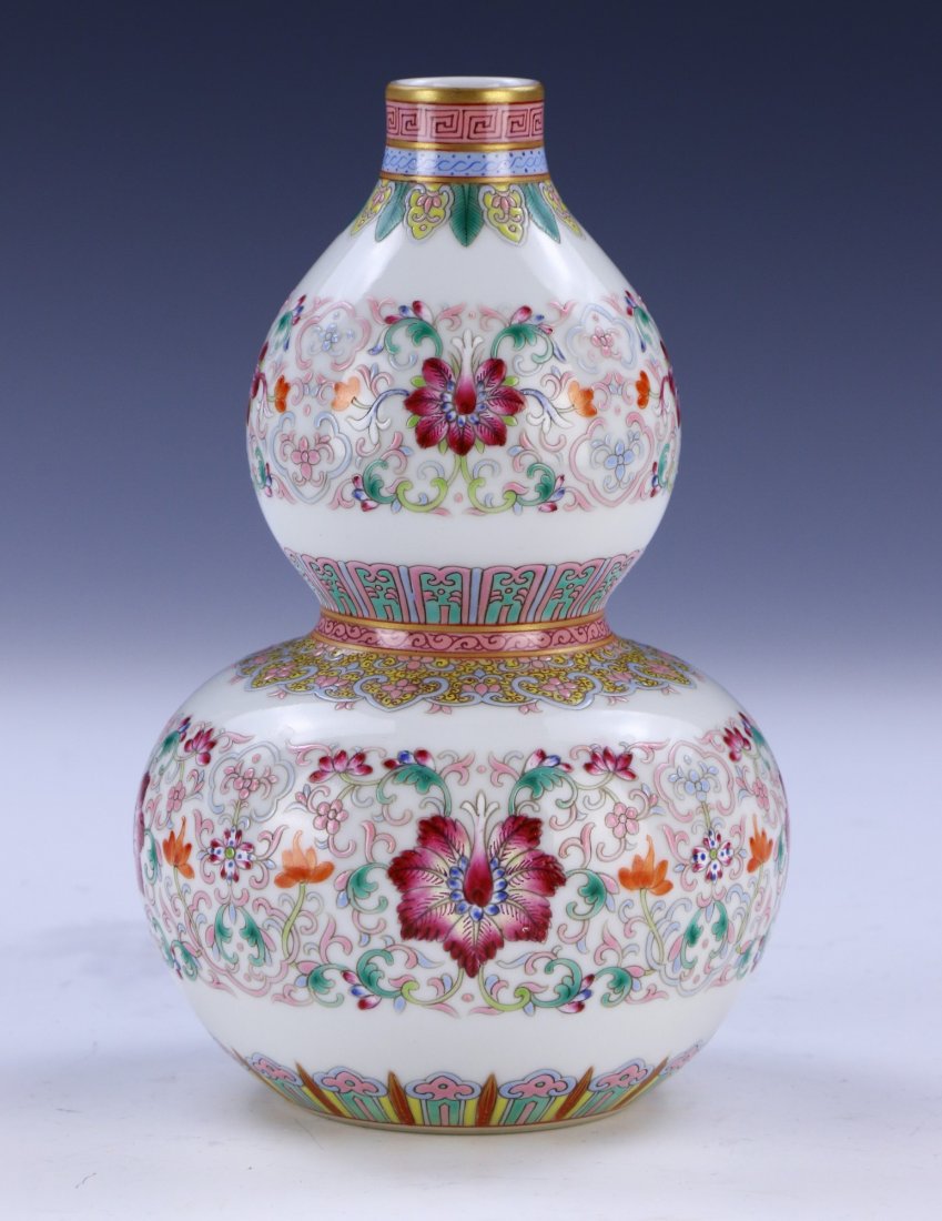 A CHINESE ANTIQUE FAMILLE ROSE GILT PORCELAIN VASE: A Chinese Antique Famille Rose Gilt Porcelain Vase: Of Gourd Form, Bulbous Neck Rising To A Slightly Flared Rim With A Gilt Finish, Body Finely Painted Throughout With Blooming Flower And Vine Figures